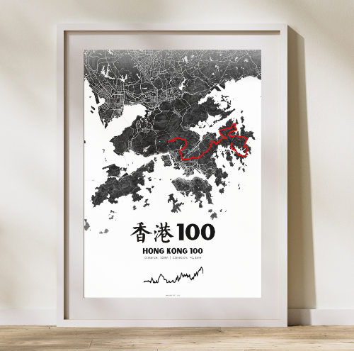 A framed poster displaying a map of Hong Kong with a highlighted ultramarathon route, titled 'Hong Kong 100'. The poster is predominantly black and white with red accents on the map.