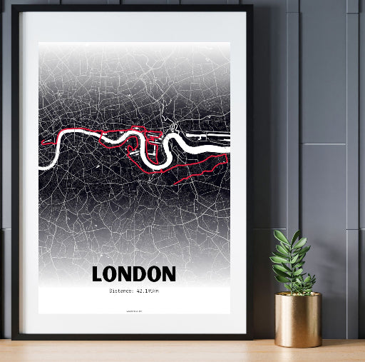 A framed poster displaying a map of the London Marathon route with black and red lines, titled 'LONDON' at the bottom.